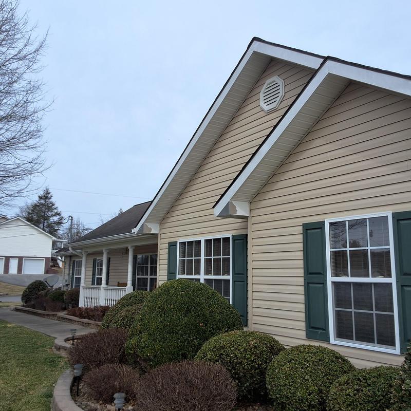 Asphalt shingle roof with hail and wind damage