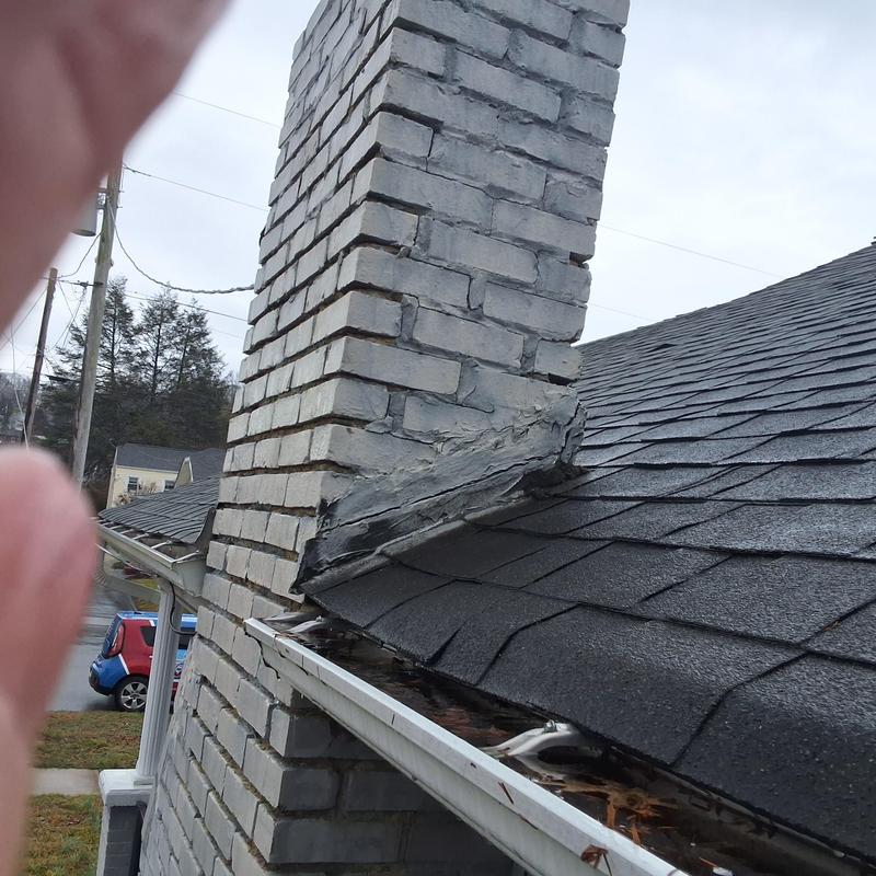 Chimney flashing and roof shingles inspection