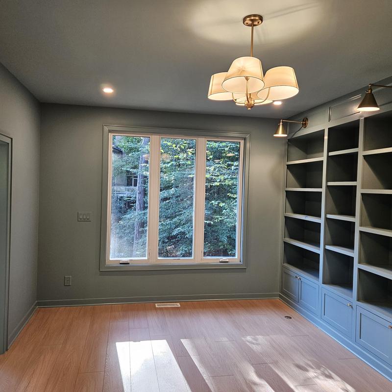 Built-in office bookshelves with window and lighting Built-in office bookshelves with window and lighting