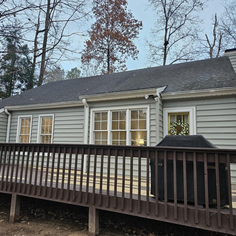 Wooden deck railing and siding on residential home
