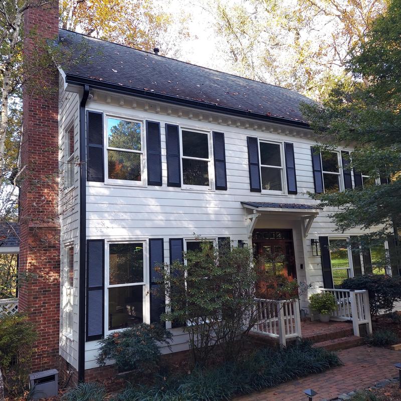 Window installation and siding on two-story house Window installation and siding on two-story house
