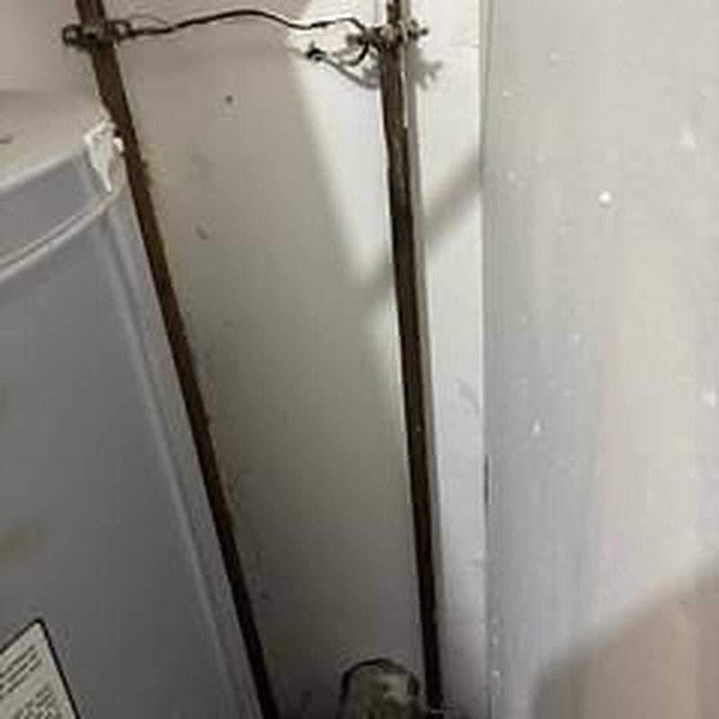 Water heater pipes with leak diagnosis in basement