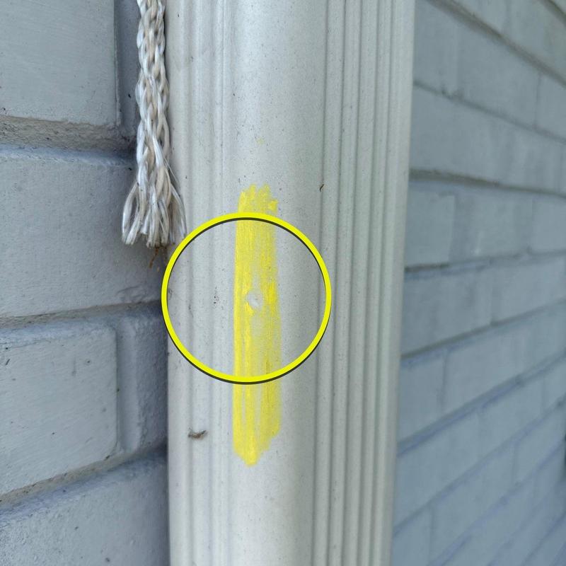 Vinyl door trim with hail damage marked in yellow