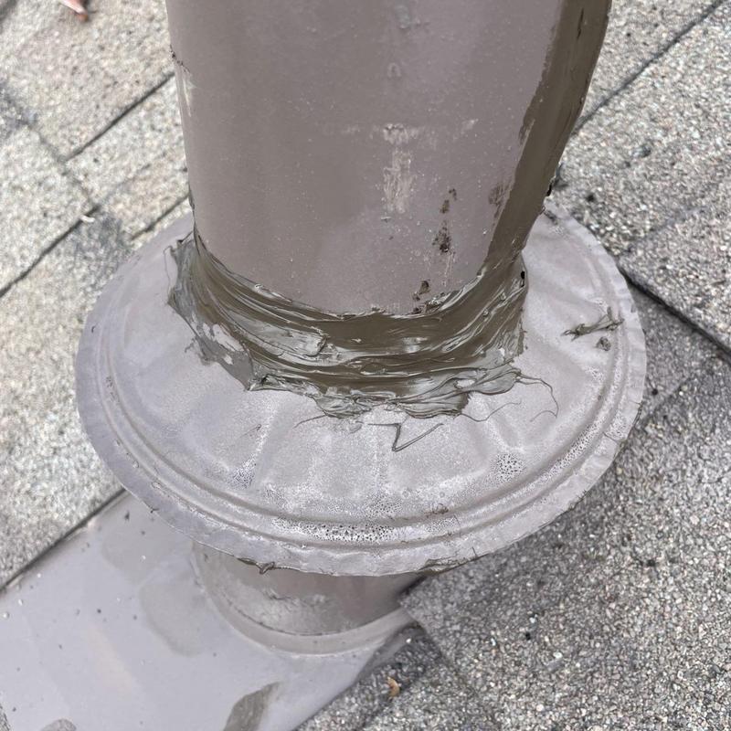 Roof plumbing vent with sealant on flashing