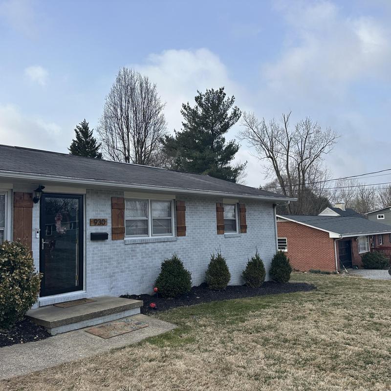 Shingle roof replacement on residential home exterior