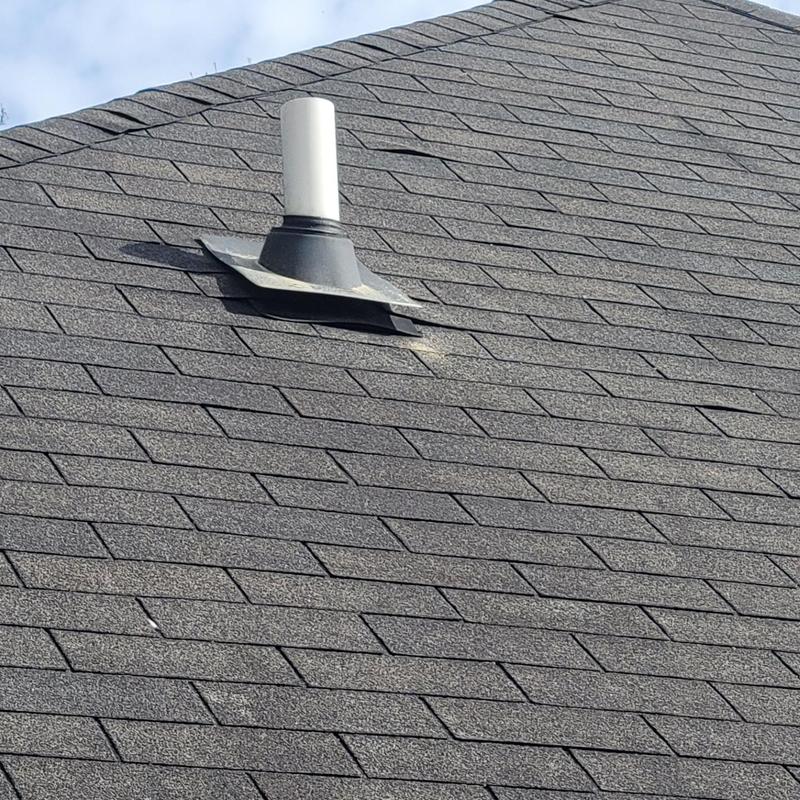 Asphalt shingle roof with plumbing vent flashing