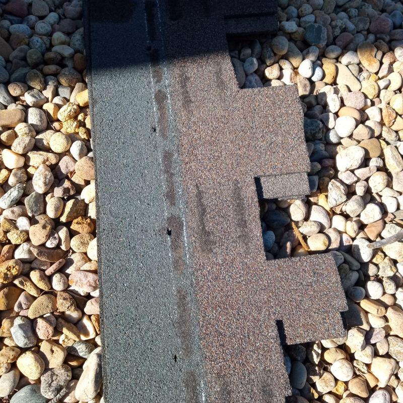 Presidential roofing shingles on gravel ground close-up Presidential roofing shingles on gravel ground close-up