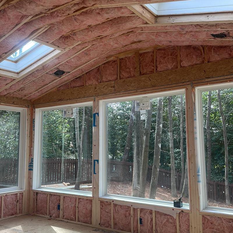 Fiberglass insulation installed in windowed room walls and ceiling