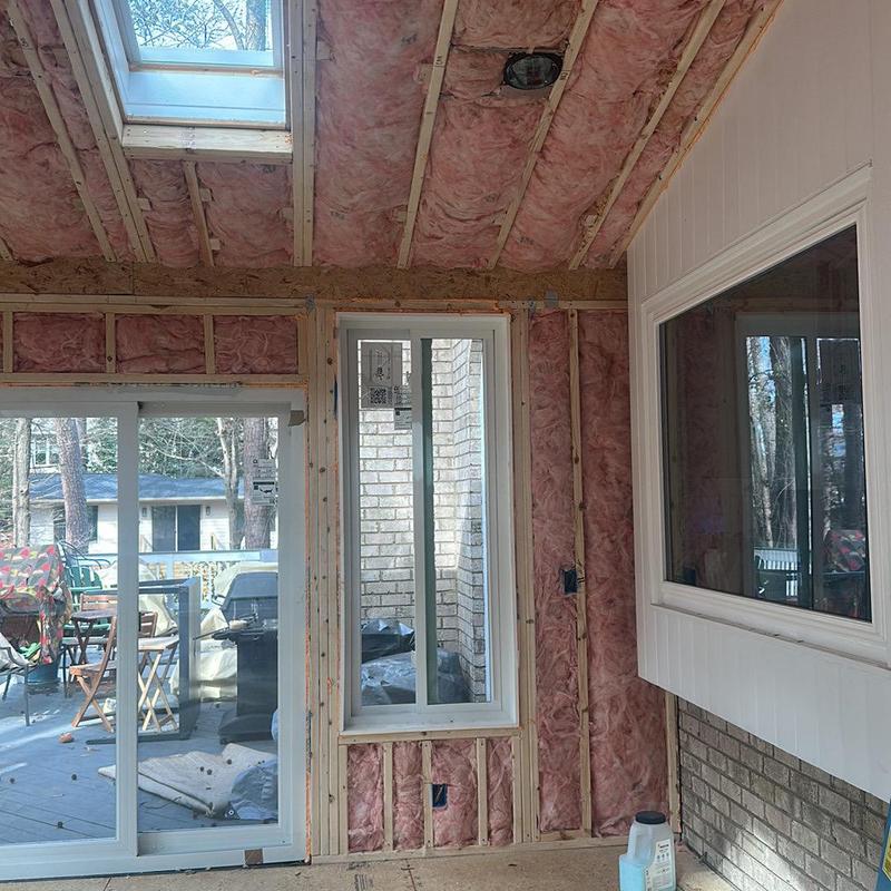 Fiberglass insulation installed in interior wall and ceiling