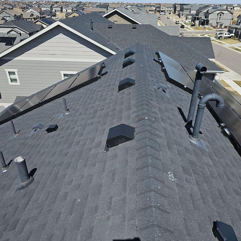 Asphalt shingle roof with vents and solar panels Asphalt shingle roof with vents and solar panels