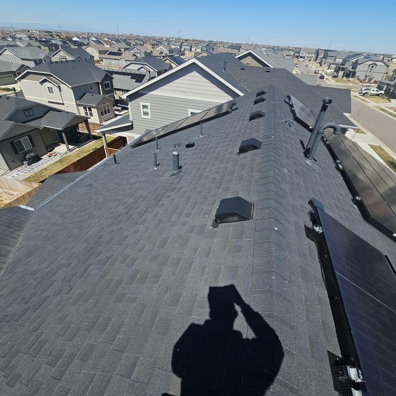 Asphalt shingle roof with vents and solar panels Asphalt shingle roof with vents and solar panels