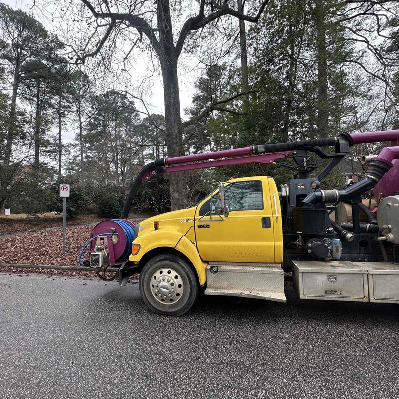 Vacuum truck with hose for sewer cleaning in street Vacuum truck with hose for sewer cleaning in street