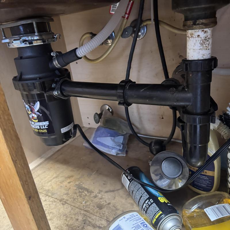 Garbage disposal unit and drain pipes under sink