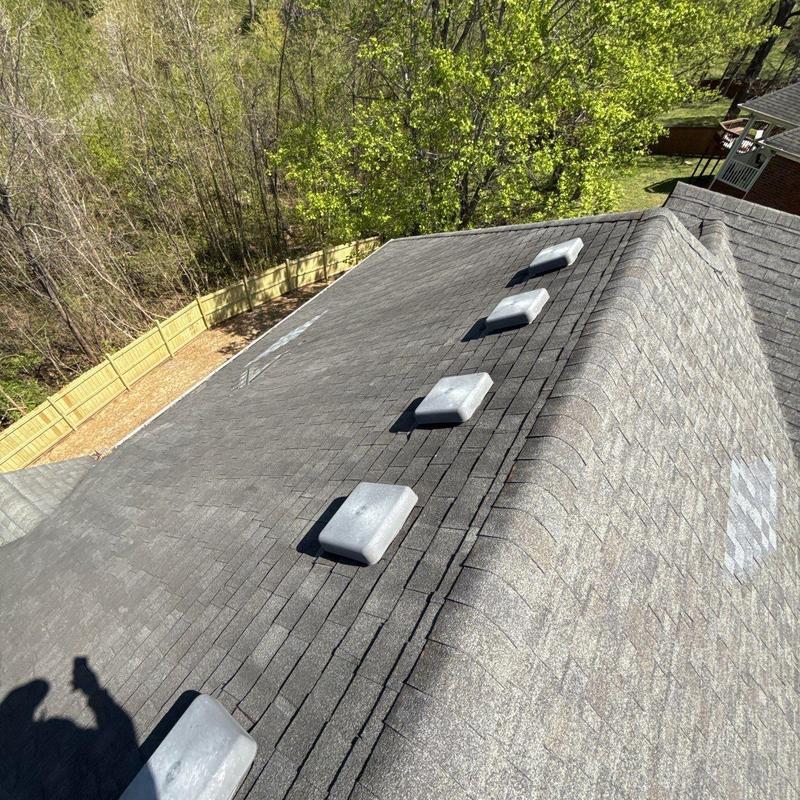 Asphalt shingles with ridge cap and ventilation units