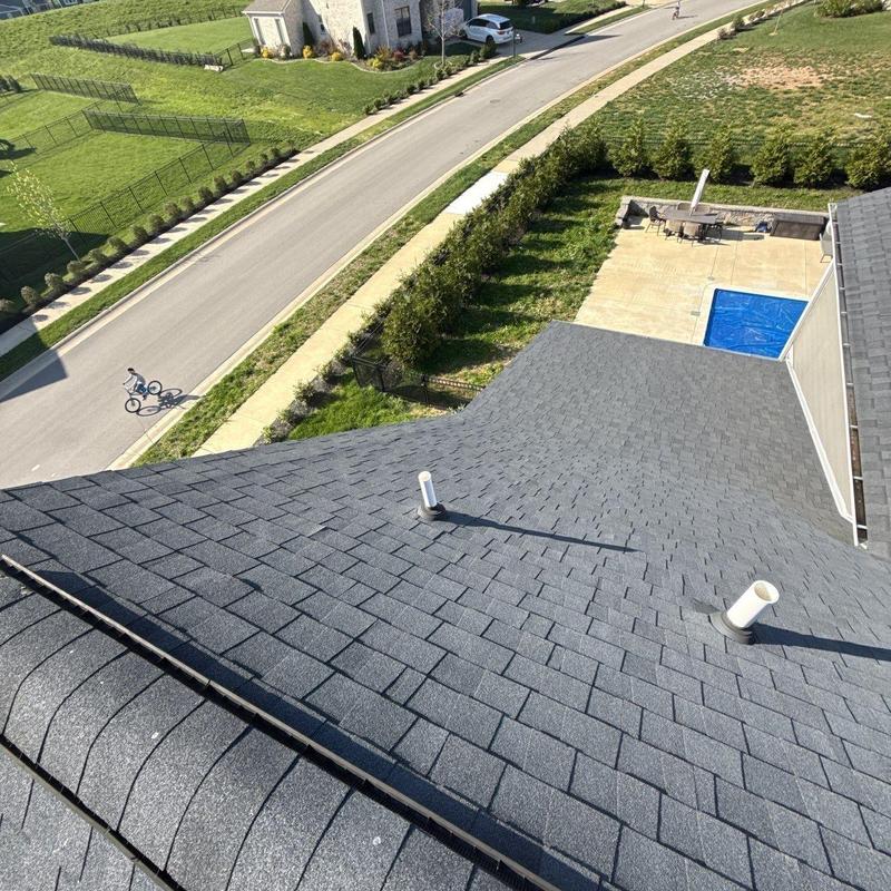 Asphalt shingle roof with vent pipe flashing inspection