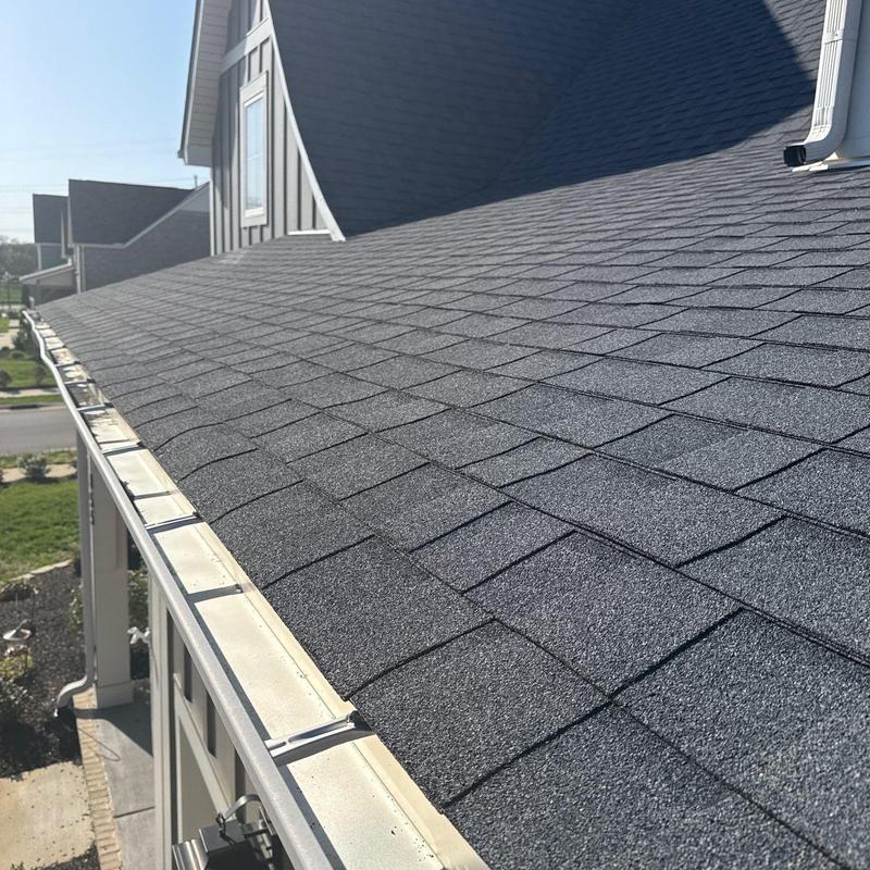 Asphalt shingle roof with gutter and flashing inspection