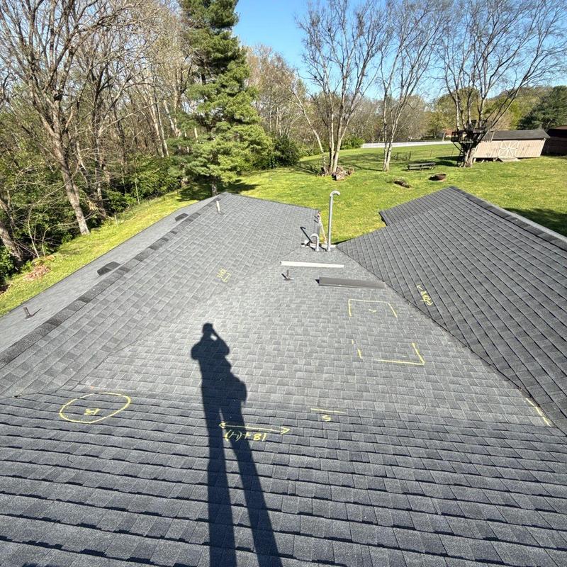 Asphalt shingle roof with hail damage markings