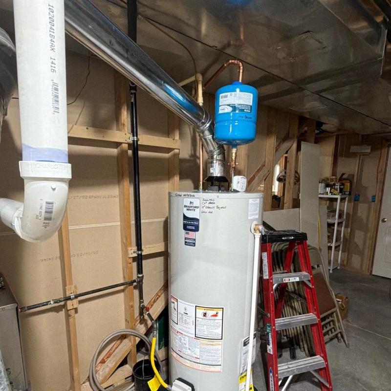 Water heater replacement with new exhaust pipe system