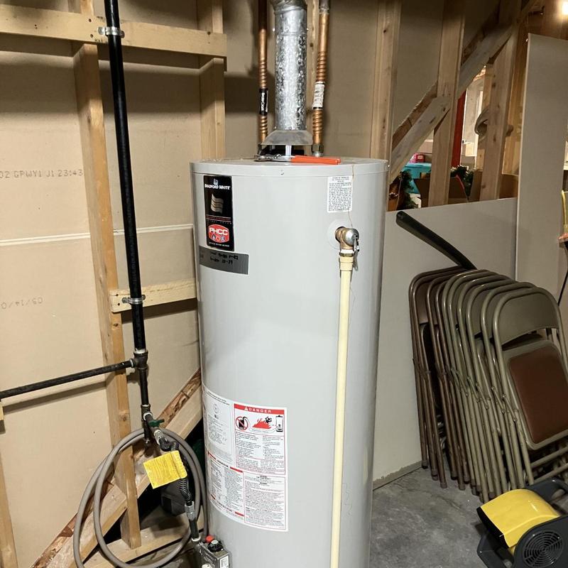 Low NOx water heater with upgraded exhaust pipe