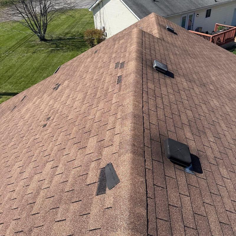 Asphalt shingle roof with hail damage and vents