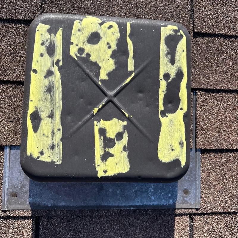 Roof vent cap with hail damage markings