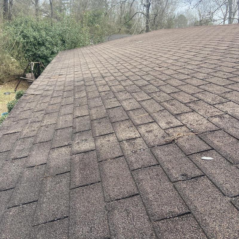 Asphalt shingle roof with storm damage inspection
