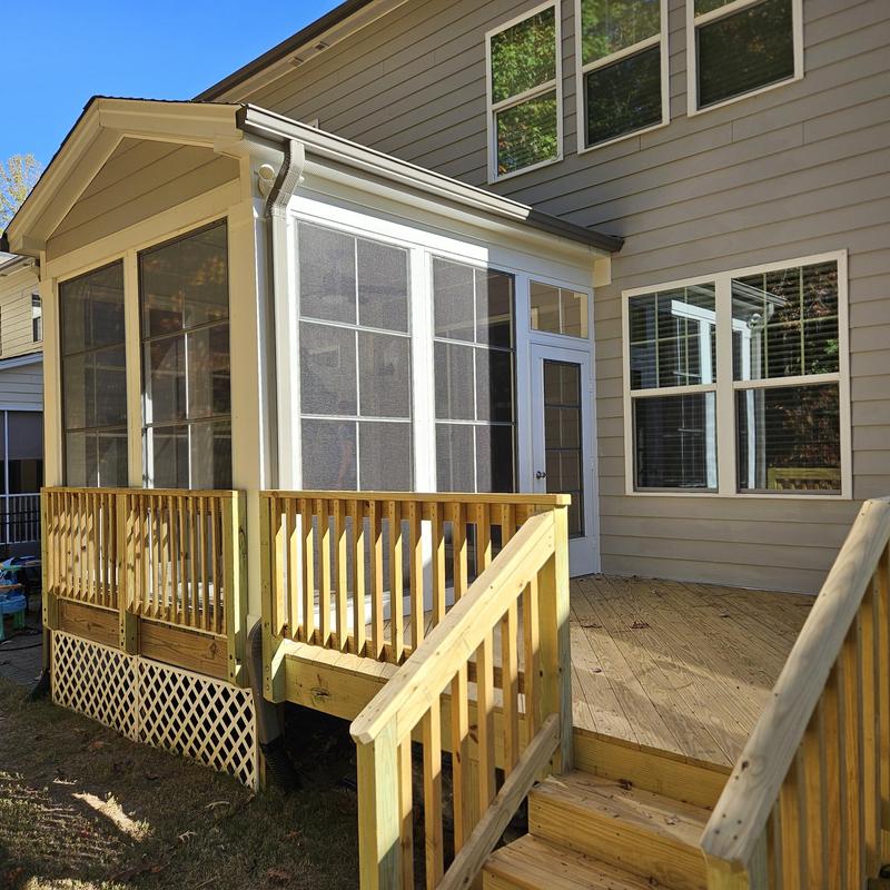 Screened porch addition with wooden deck and stairs Screened porch addition with wooden deck and stairs