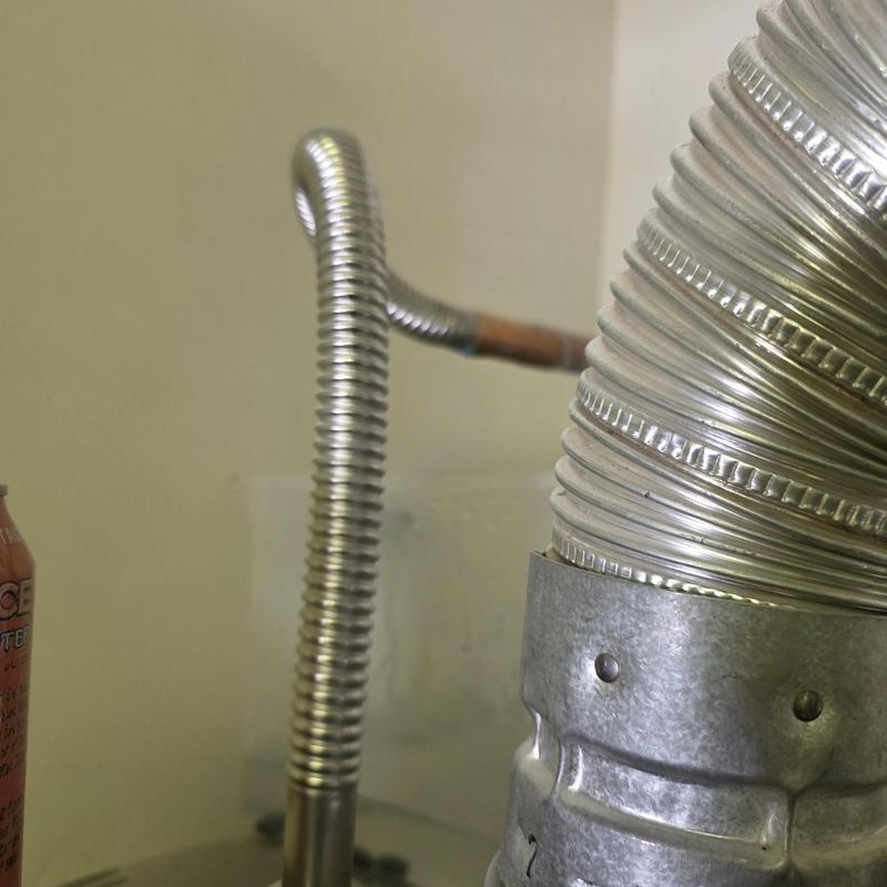 Water heater flexible supply line and vent pipe installation