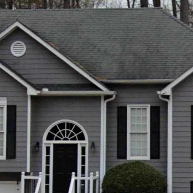 Roof shingles and gutters on residential home exterior
