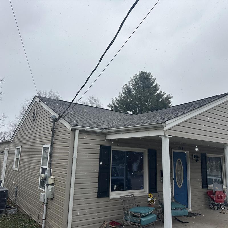 Shingle roof replacement on single-story home exterior