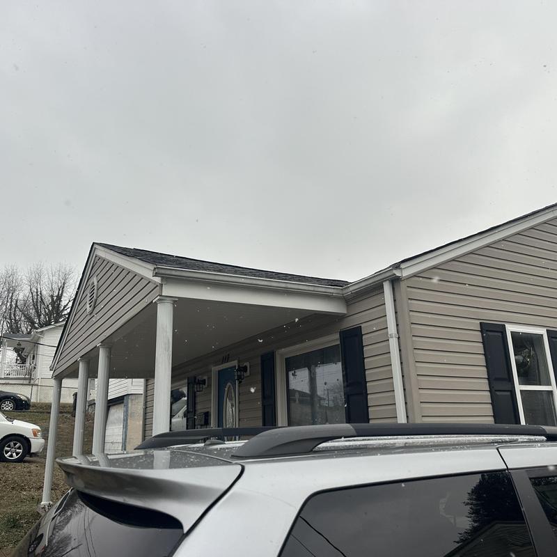 Shingle roof and porch structure on residential house