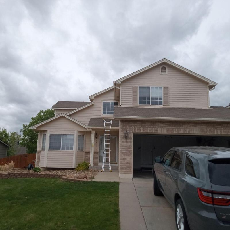 Shingle roof with ladder for wind damage inspection Shingle roof with ladder for wind damage inspection