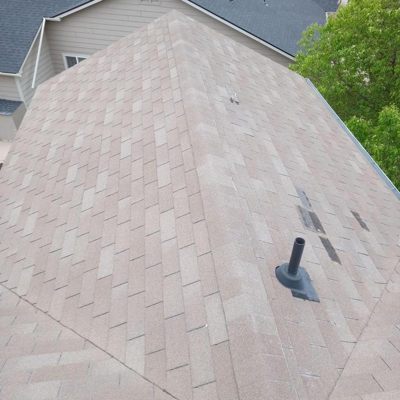 Asphalt shingle roof with minor wind damage and pipe vent Asphalt shingle roof with minor wind damage and pipe vent