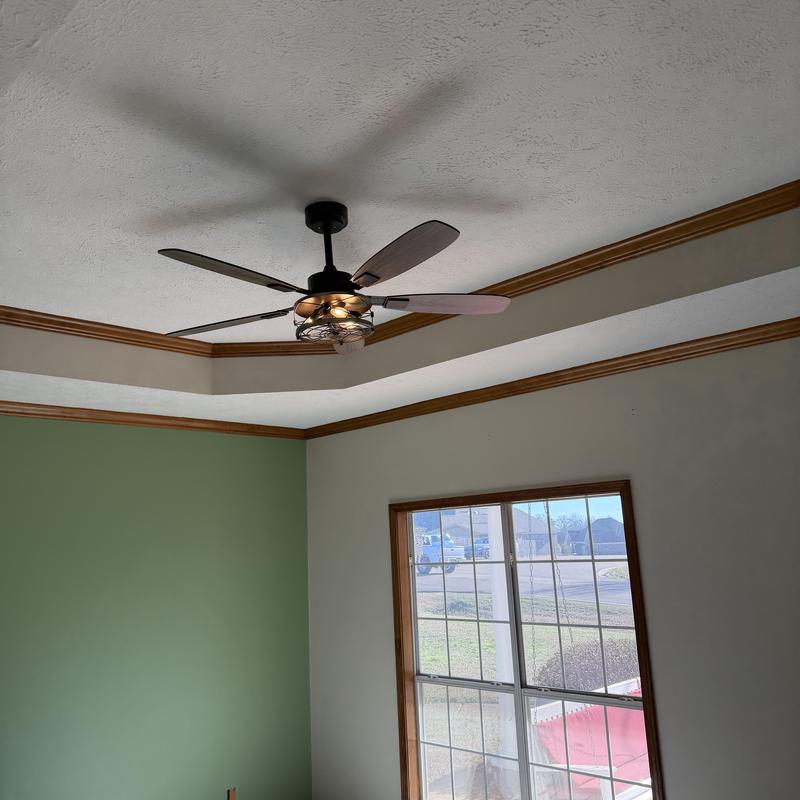 Ceiling fan with light fixture installation in living room