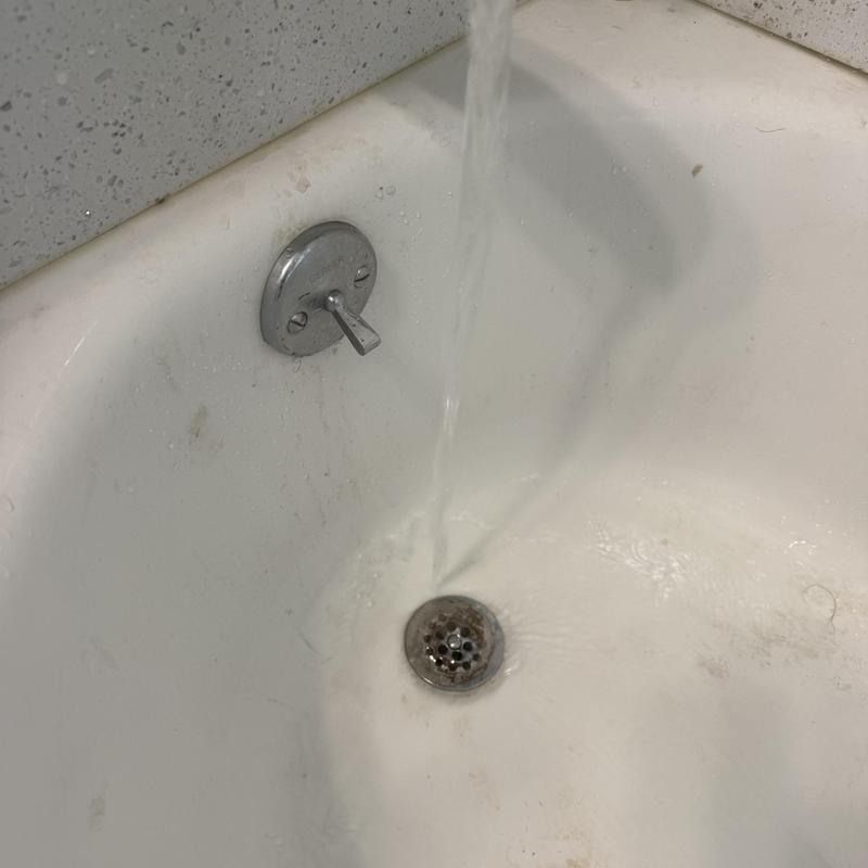 Bathtub drain flow testing after hair blockage removal