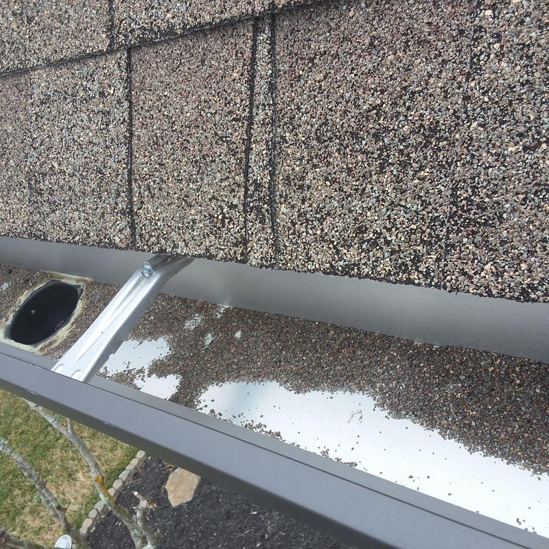 Roof shingles granule loss over metal gutter system