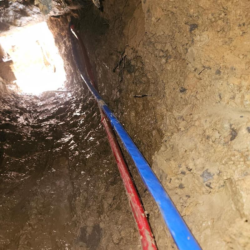 Copper water lines in dirt trench installation