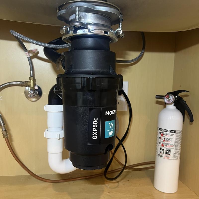 Moen garbage disposal installed under kitchen sink