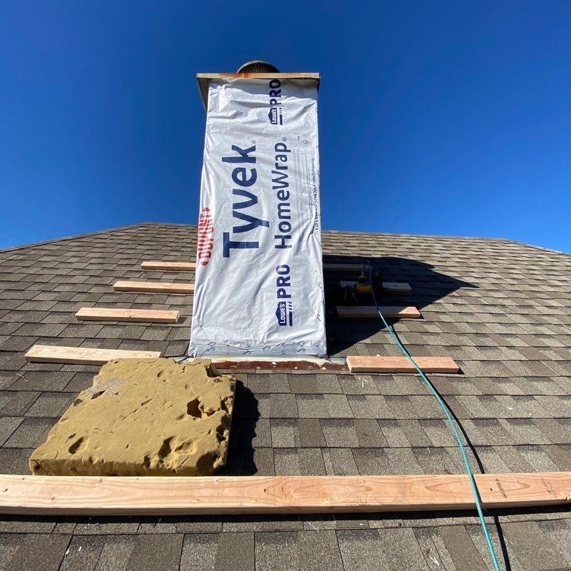 Chimney siding and trim with Tyvek wrap on roof Chimney siding and trim with Tyvek wrap on roof