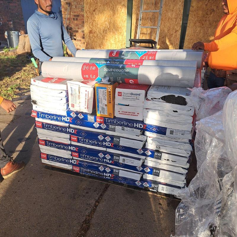 GAF Timberline HDZ roofing shingles stacked for installation