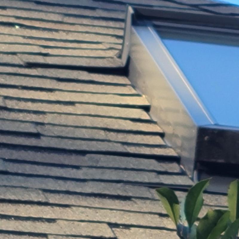 Attic vent flashing with sealed roof shingles