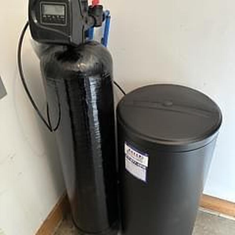 Water softener system with brine tank in utility room