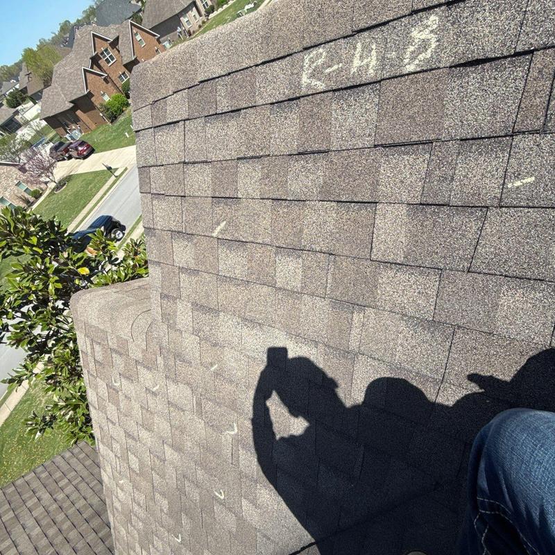 Asphalt shingle roof with hail damage markings