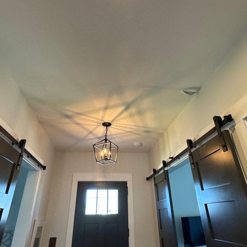 Light fixture with geometric metal frame and bulbs