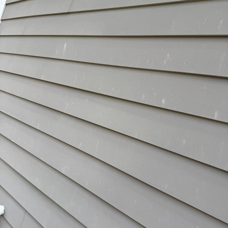 Vinyl siding with minor surface stains and marks