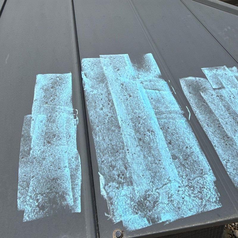 Metal roof panels with hail damage markings