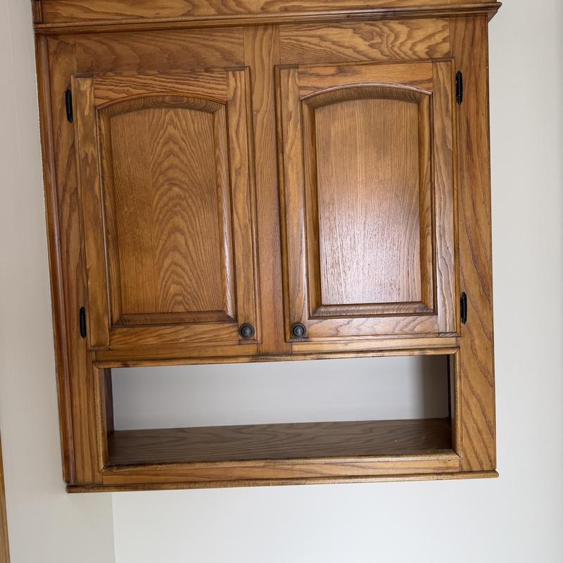 Wooden cabinet doors with new hardware pulls