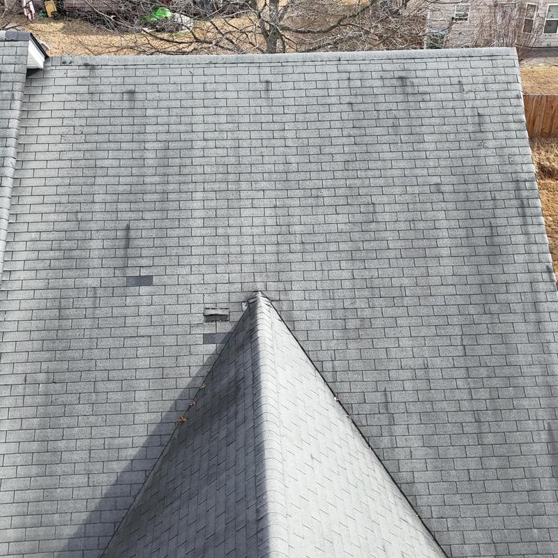 3-tab roof with missing shingles and wear visible