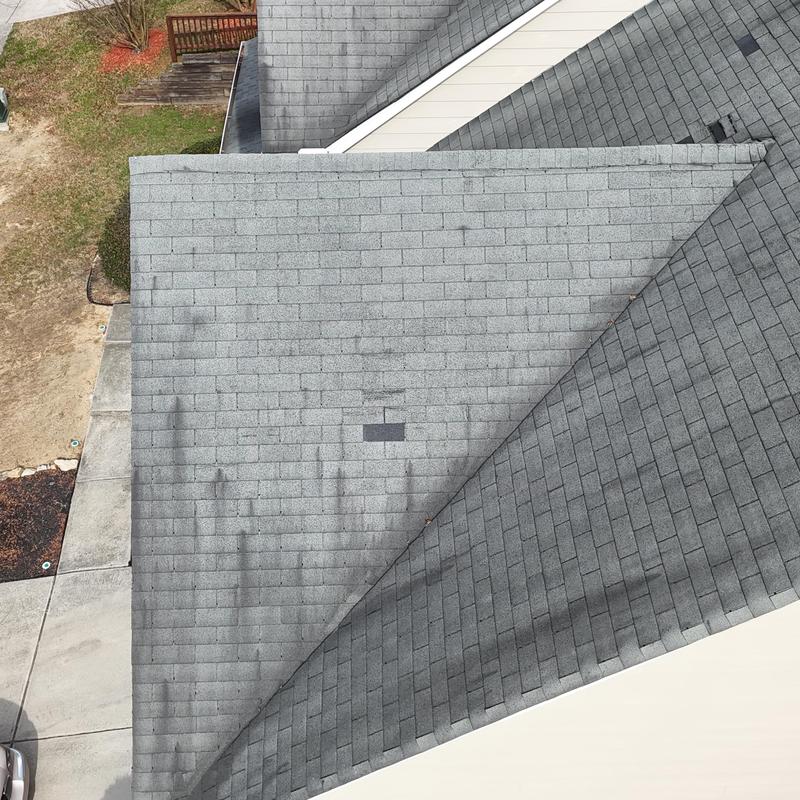 Three-tab roof with one shingle replaced and wear marks