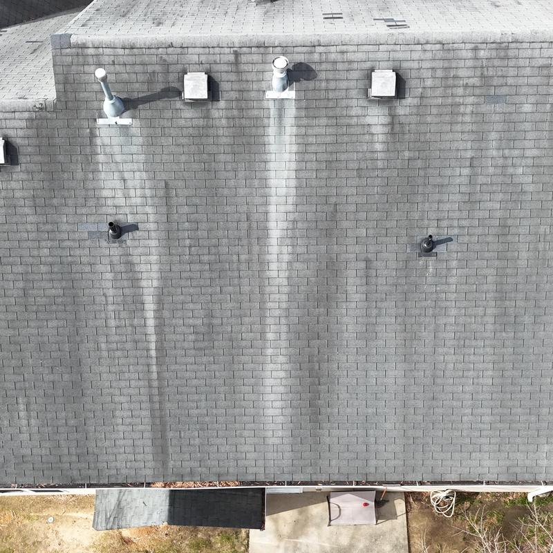 Faded slate 3-tab roof with discoloration and vents